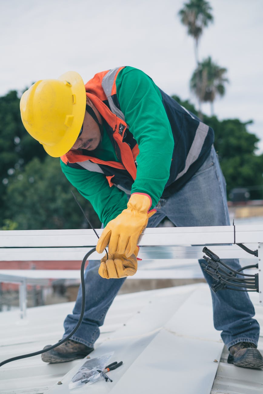 Professional roofing contractor working on residential roof installation